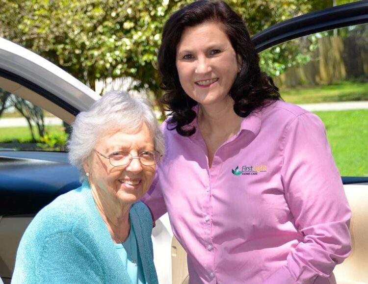A Carlsbad in-home caregiver assists her senior client