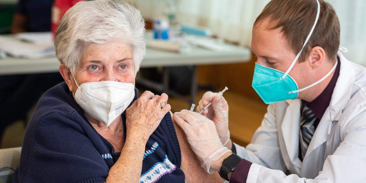 older woman getting a shot