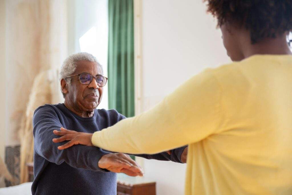 Caregiver providing personal care assistance to senior in Memphis home