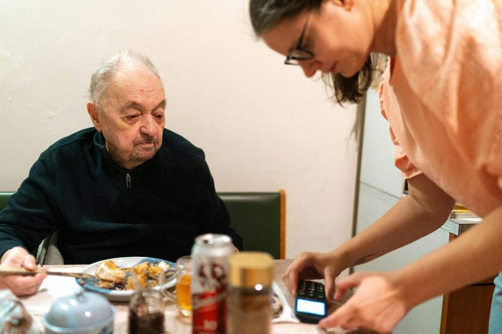 Senior at mealtime recieving in-home care
