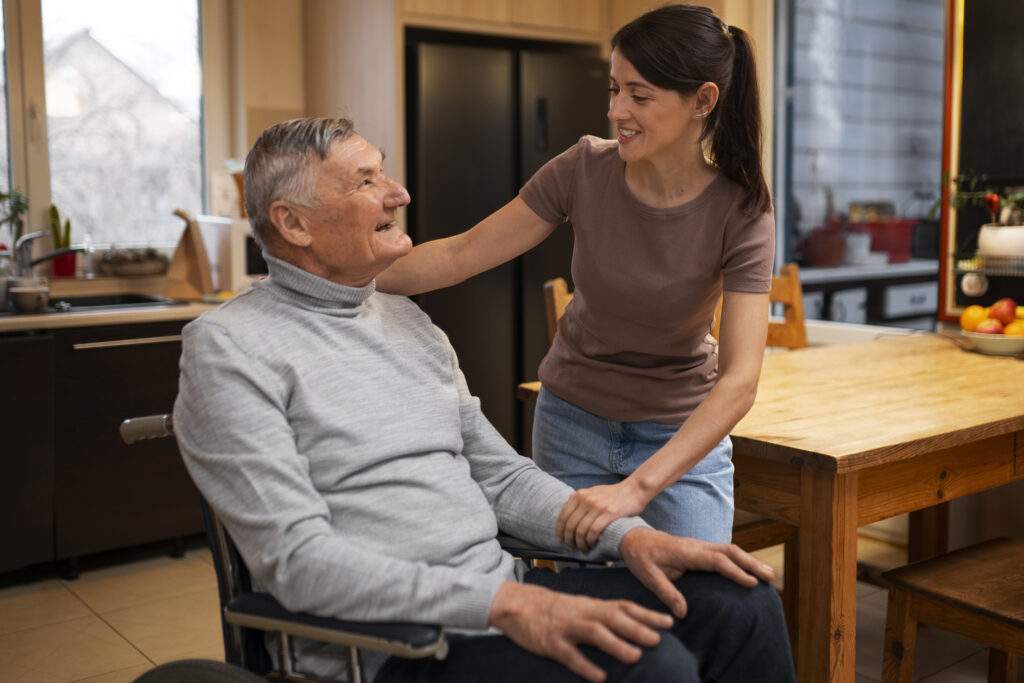 Caregiver assisting senior with daily activity while providing companion care in Memphis.