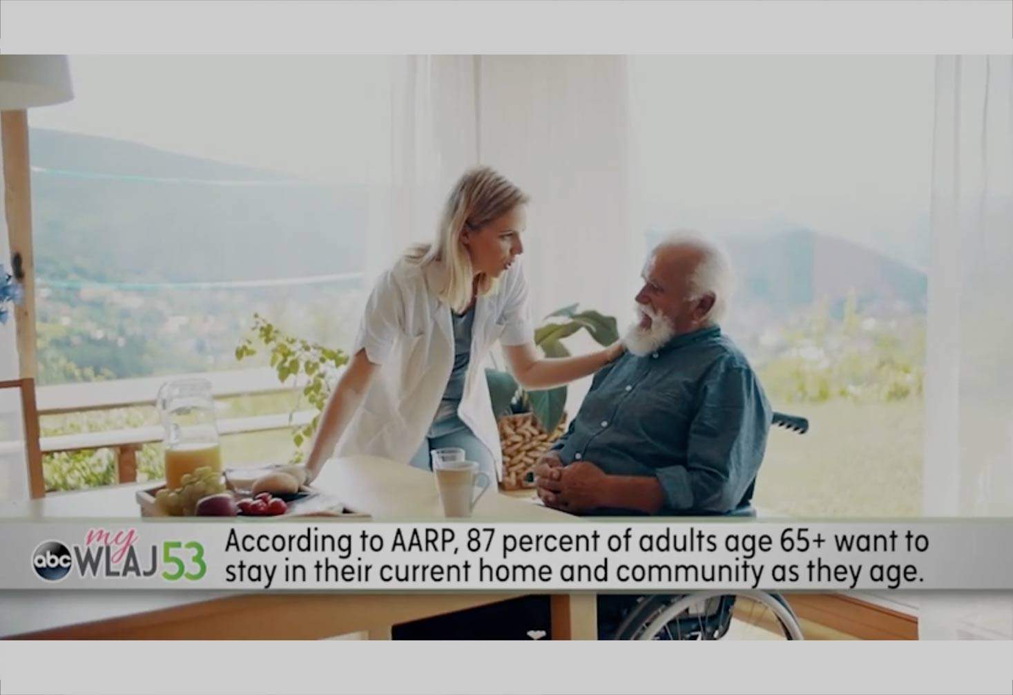 A caregiver leans over to speak to a client in a segment from Your Daily Buzz