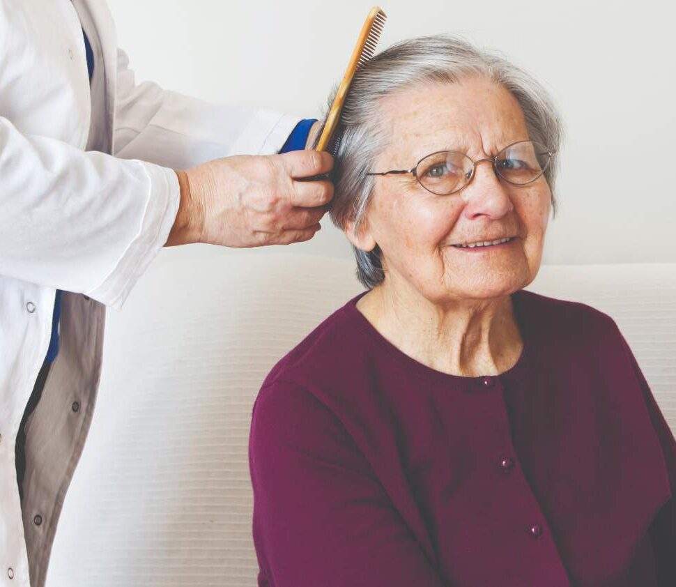 Older woman getting her hair brushed