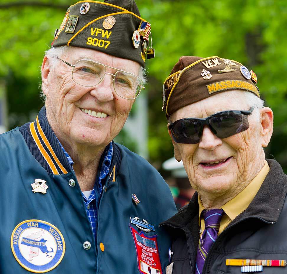 Two older men in military caps