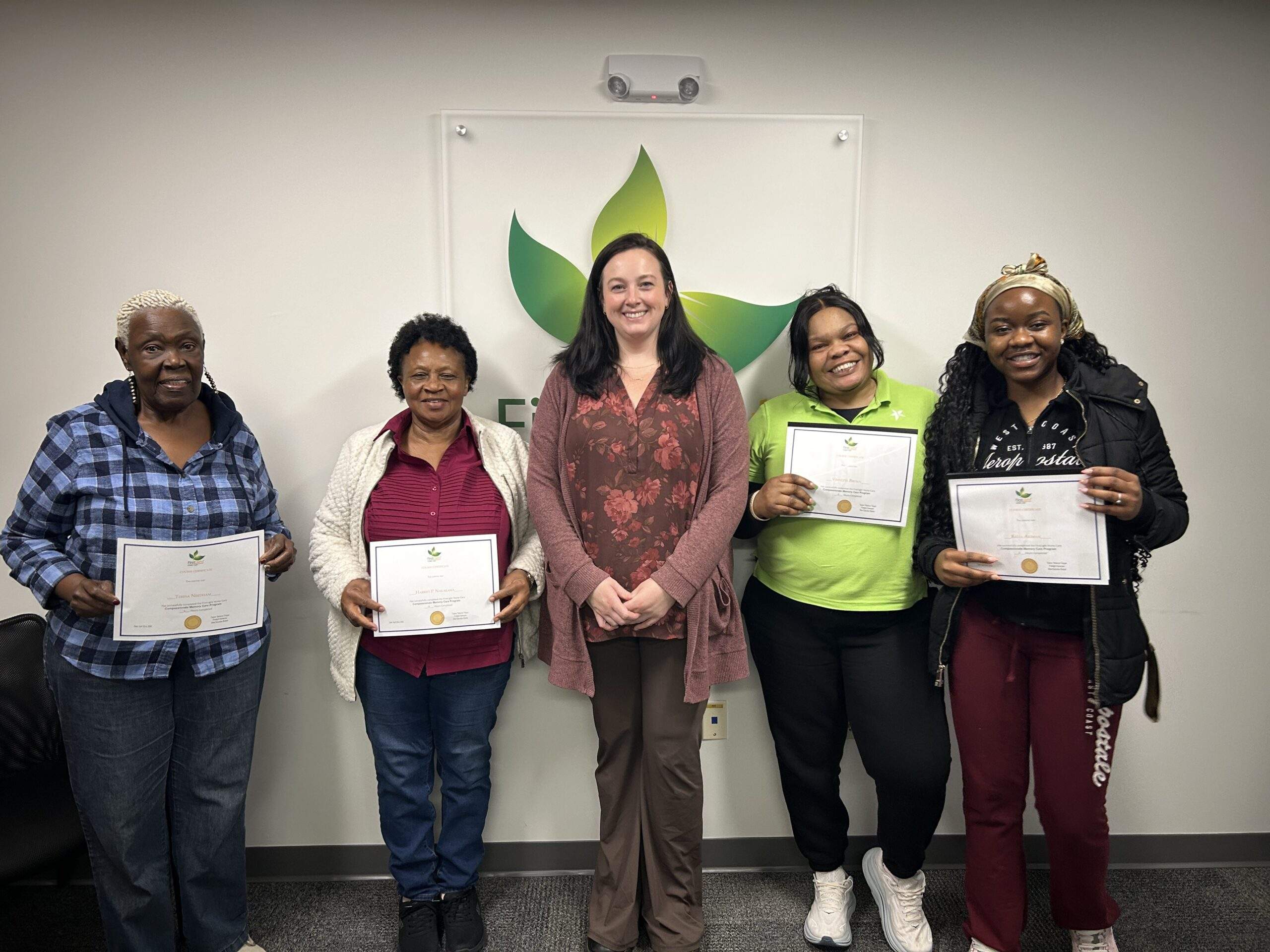 Compassionate Memory Care Program Cohort Photograph showing four individuals and instructor in center