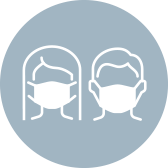 A woman and man wearing protective face masks