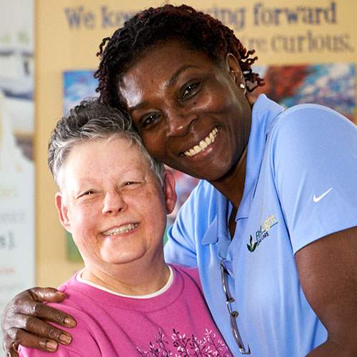 FirstLight client Paula M., with caregiver Cynthia