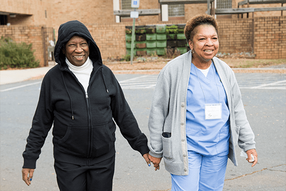 Companion Care Month - Blog Cover with a photo of a senior and their caregiver